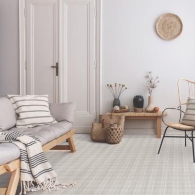 grey patterned carpet in living room with boho decor